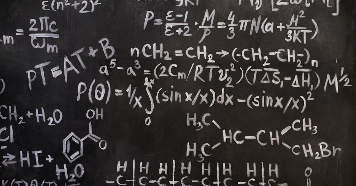 A close-up view of complex mathematical and chemical formulas on a blackboard.